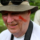 King Harald has had face paint from the red fruit annatto applied - a sign that King Harald is «one of them». Published 4 May 2013. Handout picture from the Royal Court. For editorial use only, not for sale. Photo: Rainforest Foundation Norway / ISA Brazil.